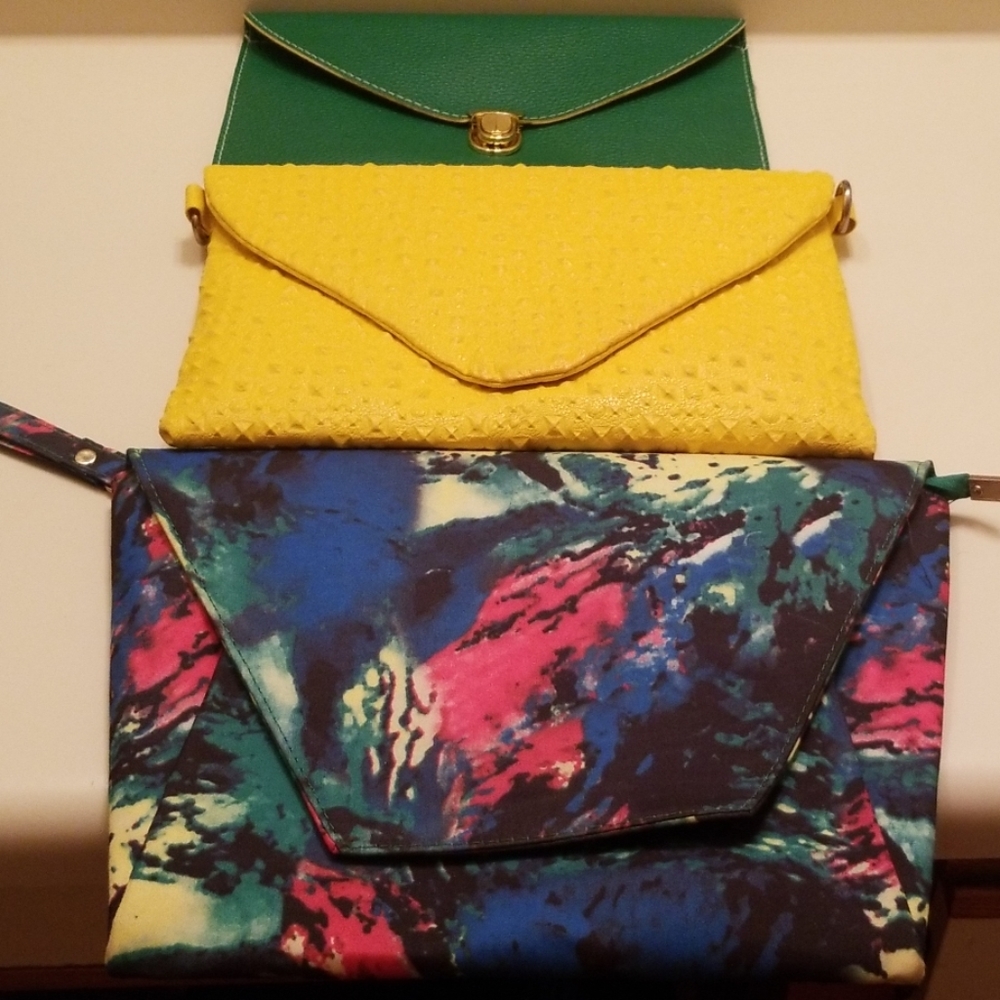 Beautiful yellow clutch purse with gold chain.